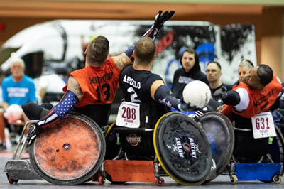 image of disabled athletes in wheelchairs playing volleyball